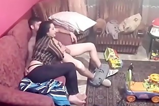Spy camera records couple fucking in the living room